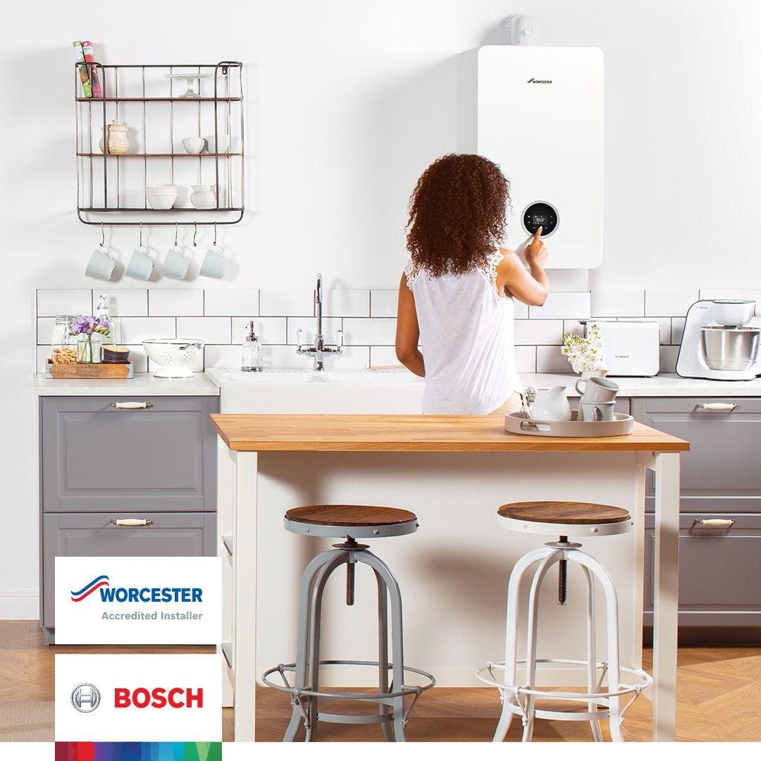 woman turning boiler on